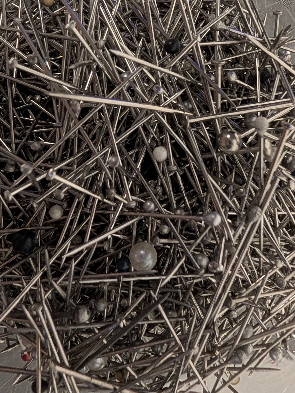 Glass Jar of Silver Sewing Pins